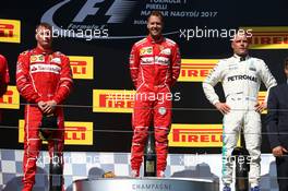 1st place Sebastian Vettel (GER) Ferrari SF70H, 2nd place Kimi Raikkonen (FIN) Ferrari SF70H and 3rd place Valtteri Bottas (FIN) Mercedes AMG F1 W08. 30.07.2017. Formula 1 World Championship, Rd 11, Hungarian Grand Prix, Budapest, Hungary, Race Day.