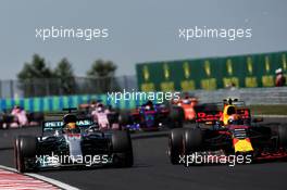 (L to R): Lewis Hamilton (GBR) Mercedes AMG F1 W08 and Max Verstappen (NLD) Red Bull Racing RB13 battle for position. 30.07.2017. Formula 1 World Championship, Rd 11, Hungarian Grand Prix, Budapest, Hungary, Race Day.