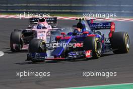 Carlos Sainz Jr (ESP) Scuderia Toro Rosso and Sergio Perez (MEX) Sahara Force India F1   30.07.2017. Formula 1 World Championship, Rd 11, Hungarian Grand Prix, Budapest, Hungary, Race Day.
