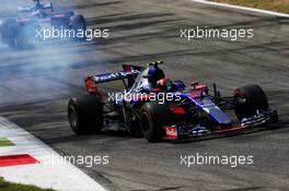 Carlos Sainz Jr (ESP) Scuderia Toro Rosso STR12 with a mechanical issue ahead of team mate Daniil Kvyat (RUS) Scuderia Toro Rosso STR12. 01.09.2017. Formula 1 World Championship, Rd 13, Italian Grand Prix, Monza, Italy, Practice Day.