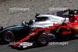 Kimi Raikkonen (FIN) Ferrari SF70H and and Valtteri Bottas (FIN) Mercedes AMG F1 W08 at the start of the race. 03.09.2017. Formula 1 World Championship, Rd 13, Italian Grand Prix, Monza, Italy, Race Day.