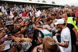 Lewis Hamilton (GBR) Mercedes AMG F1 signs autographs for the fans. 31.08.2017. Formula 1 World Championship, Rd 13, Italian Grand Prix, Monza, Italy, Preparation Day.