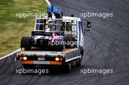 The Scuderia Toro Rosso STR12 of Carlos Sainz Jr (ESP) Scuderia Toro Rosso is recovered back to the pits on the back of a truck after he crashed in the first practice session. 06.10.2017. Formula 1 World Championship, Rd 16, Japanese Grand Prix, Suzuka, Japan, Practice Day.