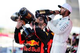 Daniel Ricciardo (AUS) Red Bull Racing celebrates his third position with the champagne on the podium. 08.10.2017. Formula 1 World Championship, Rd 16, Japanese Grand Prix, Suzuka, Japan, Race Day.