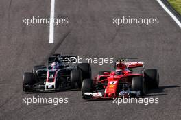 Kimi Raikkonen (FIN) Ferrari SF70H and Romain Grosjean (FRA) Haas F1 Team VF-17 battle for position. 08.10.2017. Formula 1 World Championship, Rd 16, Japanese Grand Prix, Suzuka, Japan, Race Day.