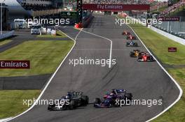 Romain Grosjean (FRA) Haas F1 Team VF-17 and Pierre Gasly (FRA) Scuderia Toro Rosso STR12 battle for position. 08.10.2017. Formula 1 World Championship, Rd 16, Japanese Grand Prix, Suzuka, Japan, Race Day.