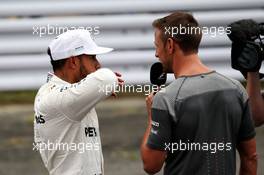 (L to R): pole sitter Lewis Hamilton (GBR) Mercedes AMG F1 interviewed in qualifying parc ferme by Jenson Button (GBR) McLaren. 07.10.2017. Formula 1 World Championship, Rd 16, Japanese Grand Prix, Suzuka, Japan, Qualifying Day.