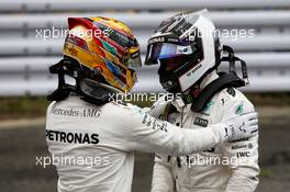 (L to R): Lewis Hamilton (GBR) Mercedes AMG F1 celebrates his pole position in qualifying parc ferme with second placed team mate Valtteri Bottas (FIN) Mercedes AMG F1. 07.10.2017. Formula 1 World Championship, Rd 16, Japanese Grand Prix, Suzuka, Japan, Qualifying Day.