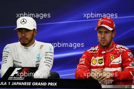 (L to R): Lewis Hamilton (GBR) Mercedes AMG F1 and Sebastian Vettel (GER) Ferrari in the post qualifying FIA Press Conference. 07.10.2017. Formula 1 World Championship, Rd 16, Japanese Grand Prix, Suzuka, Japan, Qualifying Day.