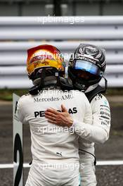 (L to R): Lewis Hamilton (GBR) Mercedes AMG F1 celebrates his pole position in qualifying parc ferme with second placed team mate Valtteri Bottas (FIN) Mercedes AMG F1. 07.10.2017. Formula 1 World Championship, Rd 16, Japanese Grand Prix, Suzuka, Japan, Qualifying Day.