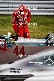 Sebastian Vettel (GER) Ferrari looks at the Mercedes AMG F1 W08 of Valtteri Bottas (FIN) Mercedes AMG F1 in qualifying parc ferme. 07.10.2017. Formula 1 World Championship, Rd 16, Japanese Grand Prix, Suzuka, Japan, Qualifying Day.