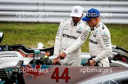 (L to R): Lewis Hamilton (GBR) Mercedes AMG F1 with team mate Valtteri Bottas (FIN) Mercedes AMG F1 in qualifying parc ferme. 07.10.2017. Formula 1 World Championship, Rd 16, Japanese Grand Prix, Suzuka, Japan, Qualifying Day.