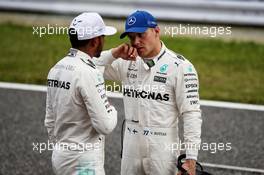 (L to R): Lewis Hamilton (GBR) Mercedes AMG F1 in qualifying parc ferme with team mate Valtteri Bottas (FIN) Mercedes AMG F1. 07.10.2017. Formula 1 World Championship, Rd 16, Japanese Grand Prix, Suzuka, Japan, Qualifying Day.