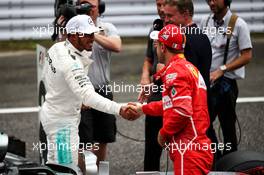 (L to R): Lewis Hamilton (GBR) Mercedes AMG F1 celebrates his pole position in qualifying parc ferme with third placed Sebastian Vettel (GER) Ferrari. 07.10.2017. Formula 1 World Championship, Rd 16, Japanese Grand Prix, Suzuka, Japan, Qualifying Day.