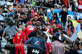 Sebastian Vettel (GER) Ferrari with fans in the grandstand. 05.10.2017. Formula 1 World Championship, Rd 16, Japanese Grand Prix, Suzuka, Japan, Preparation Day.