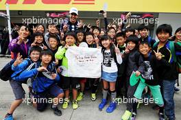 Esteban Ocon (FRA) Sahara Force India F1 Team with school children. 05.10.2017. Formula 1 World Championship, Rd 16, Japanese Grand Prix, Suzuka, Japan, Preparation Day.