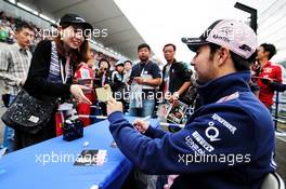 Sergio Perez (MEX) Sahara Force India F1 signs autographs for the fans. 05.10.2017. Formula 1 World Championship, Rd 16, Japanese Grand Prix, Suzuka, Japan, Preparation Day.