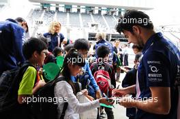 Sergio Perez (MEX) Sahara Force India F1 signs autographs for the school children.   05.10.2017. Formula 1 World Championship, Rd 16, Japanese Grand Prix, Suzuka, Japan, Preparation Day.