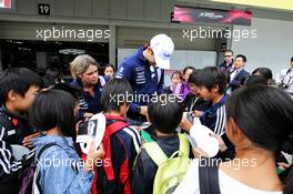 Esteban Ocon (FRA) Sahara Force India F1 Team signs autographs for the school children.   05.10.2017. Formula 1 World Championship, Rd 16, Japanese Grand Prix, Suzuka, Japan, Preparation Day.