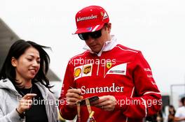 Kimi Raikkonen (FIN) Ferrari signs autographs for the fans. 05.10.2017. Formula 1 World Championship, Rd 16, Japanese Grand Prix, Suzuka, Japan, Preparation Day.