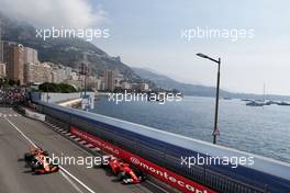 Kimi Raikkonen (FIN) Ferrari SF70H and Jenson Button (GBR) McLaren MCL32. 25.05.2017. Formula 1 World Championship, Rd 6, Monaco Grand Prix, Monte Carlo, Monaco, Practice Day.