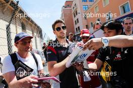 Romain Grosjean (FRA) Haas F1 Team signs autographs for the fans. 24.05.2017. Formula 1 World Championship, Rd 6, Monaco Grand Prix, Monte Carlo, Monaco, Preparation Day.