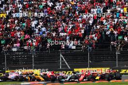 Sebastian Vettel (GER) Ferrari SF70H, Max Verstappen (NLD) Red Bull Racing RB13, and Lewis Hamilton (GBR) Mercedes AMG F1 W08 battle for the lead at the start of the race. 29.10.2017. Formula 1 World Championship, Rd 18, Mexican Grand Prix, Mexico City, Mexico, Race Day.