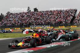 Sebastian Vettel (GER) Ferrari SF70H, Max Verstappen (NLD) Red Bull Racing RB13, and Lewis Hamilton (GBR) Mercedes AMG F1 W08 battle for the lead at the start of the race. 29.10.2017. Formula 1 World Championship, Rd 18, Mexican Grand Prix, Mexico City, Mexico, Race Day.