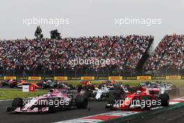 Sergio Perez (MEX) Sahara Force India F1 VJM10 and Kimi Raikkonen (FIN) Ferrari SF70H at the start of the race. 29.10.2017. Formula 1 World Championship, Rd 18, Mexican Grand Prix, Mexico City, Mexico, Race Day.