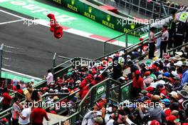 A flying Elmo with fans in the grandstand. 29.10.2017. Formula 1 World Championship, Rd 18, Mexican Grand Prix, Mexico City, Mexico, Race Day.