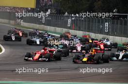 Sebastian Vettel (GER) Ferrari SF70H, Max Verstappen (NLD) Red Bull Racing RB13, and Lewis Hamilton (GBR) Mercedes AMG F1 W08 battle for the lead at the start of the race. 29.10.2017. Formula 1 World Championship, Rd 18, Mexican Grand Prix, Mexico City, Mexico, Race Day.