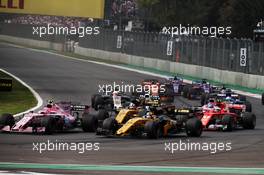 Esteban Ocon (FRA) Sahara Force India F1 VJM10, Nico Hulkenberg (GER) Renault Sport F1 Team RS17, and Carlos Sainz Jr (ESP) Renault Sport F1 Team RS17, at the start of the race. 29.10.2017. Formula 1 World Championship, Rd 18, Mexican Grand Prix, Mexico City, Mexico, Race Day.