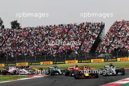 Sebastian Vettel (GER) Ferrari SF70H, Max Verstappen (NLD) Red Bull Racing RB13, and Lewis Hamilton (GBR) Mercedes AMG F1 W08 battle for the lead at the start of the race. 29.10.2017. Formula 1 World Championship, Rd 18, Mexican Grand Prix, Mexico City, Mexico, Race Day.