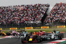 Sebastian Vettel (GER) Ferrari SF70H, Max Verstappen (NLD) Red Bull Racing RB13, and Lewis Hamilton (GBR) Mercedes AMG F1 W08 battle for the lead at the start of the race. 29.10.2017. Formula 1 World Championship, Rd 18, Mexican Grand Prix, Mexico City, Mexico, Race Day.