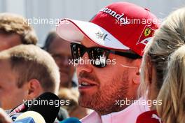 Sebastian Vettel (GER) Ferrari with the media. 26.10.2017. Formula 1 World Championship, Rd 18, Mexican Grand Prix, Mexico City, Mexico, Preparation Day.