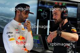 Daniel Ricciardo (AUS) Red Bull Racing with Simon Rennie (GBR) Red Bull Racing Race Engineer. 29.09.2017. Formula 1 World Championship, Rd 15, Malaysian Grand Prix, Sepang, Malaysia, Friday.