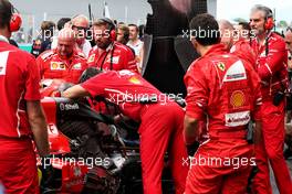 The Ferrari SF70H of Kimi Raikkonen (FIN) Ferrari with a problem on the grid. 01.10.2017. Formula 1 World Championship, Rd 15, Malaysian Grand Prix, Sepang, Malaysia, Sunday.