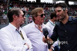 Mark Webber (AUS) Channel 4 Presenter on the grid with Danny Sullivan (USA) FIA Steward (Centre).                                01.10.2017. Formula 1 World Championship, Rd 15, Malaysian Grand Prix, Sepang, Malaysia, Sunday.