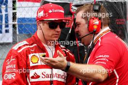 (L to R): Kimi Raikkonen (FIN) Ferrari with Dave Greenwood (GBR) Ferrari Race Engineer on the grid. 01.10.2017. Formula 1 World Championship, Rd 15, Malaysian Grand Prix, Sepang, Malaysia, Sunday.