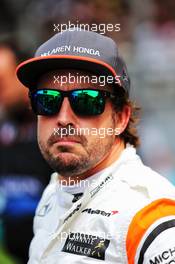 Fernando Alonso (ESP) McLaren on the grid. 01.10.2017. Formula 1 World Championship, Rd 15, Malaysian Grand Prix, Sepang, Malaysia, Sunday.