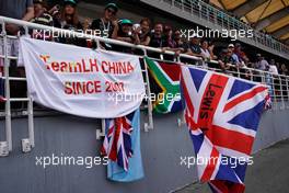 Fans of Lewis Hamilton (GBR) Mercedes AMG F1 W08 in the grandstand with banners and flags.                                01.10.2017. Formula 1 World Championship, Rd 15, Malaysian Grand Prix, Sepang, Malaysia, Sunday.