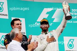 Lewis Hamilton (GBR) Mercedes AMG F1 celebrates his second position on the podium. 01.10.2017. Formula 1 World Championship, Rd 15, Malaysian Grand Prix, Sepang, Malaysia, Sunday.