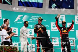 The podium (L to R): Lewis Hamilton (GBR) Mercedes AMG F1, second; Max Verstappen (NLD) Red Bull Racing, race winner; Daniel Ricciardo (AUS) Red Bull Racing, third. 01.10.2017. Formula 1 World Championship, Rd 15, Malaysian Grand Prix, Sepang, Malaysia, Sunday.