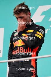 Race winner Max Verstappen (NLD) Red Bull Racing on the podium. 01.10.2017. Formula 1 World Championship, Rd 15, Malaysian Grand Prix, Sepang, Malaysia, Sunday.