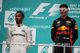 2nd place Lewis Hamilton (GBR) Mercedes AMG F1 W08 and 1st place Max Verstappen (NLD) Red Bull Racing. 01.10.2017. Formula 1 World Championship, Rd 15, Malaysian Grand Prix, Sepang, Malaysia, Sunday.