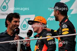 (L to R): Mark Webber (AUS) Channel 4 Presenter on the podium race winner Max Verstappen (NLD) Red Bull Racing and third placed Daniel Ricciardo (AUS) Red Bull Racing. 01.10.2017. Formula 1 World Championship, Rd 15, Malaysian Grand Prix, Sepang, Malaysia, Sunday.