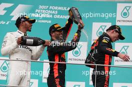 2nd place Lewis Hamilton (GBR) Mercedes AMG F1 with 3rd place Daniel Ricciardo (AUS) Red Bull Racing RB13 and 1st place Max Verstappen (NLD) Red Bull Racing. 01.10.2017. Formula 1 World Championship, Rd 15, Malaysian Grand Prix, Sepang, Malaysia, Sunday.