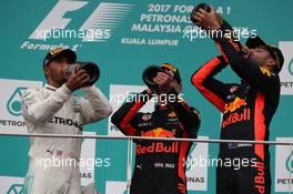 2nd place Lewis Hamilton (GBR) Mercedes AMG F1 with 1st place Max Verstappen (NLD) Red Bull Racing and 3rd place Daniel Ricciardo (AUS) Red Bull Racing RB13. 01.10.2017. Formula 1 World Championship, Rd 15, Malaysian Grand Prix, Sepang, Malaysia, Sunday.