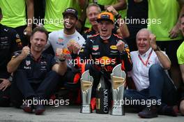Christian Horner (GBR) Red Bull Racing Team Principal celebrates with Daniel Ricciardo (AUS) Red Bull Racing RB13 Max Verstappen (NLD) Red Bull Racing RB13, Dr Helmut Marko (AUT) Red Bull Motorsport Consultant and the team. 01.10.2017. Formula 1 World Championship, Rd 15, Malaysian Grand Prix, Sepang, Malaysia, Sunday.
