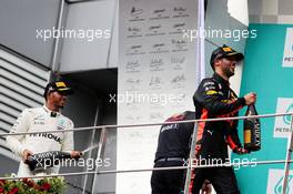 The podium (L to R): Lewis Hamilton (GBR) Mercedes AMG F1 celebrates his second position with the champagne with third placed Daniel Ricciardo (AUS) Red Bull Racing. 01.10.2017. Formula 1 World Championship, Rd 15, Malaysian Grand Prix, Sepang, Malaysia, Sunday.